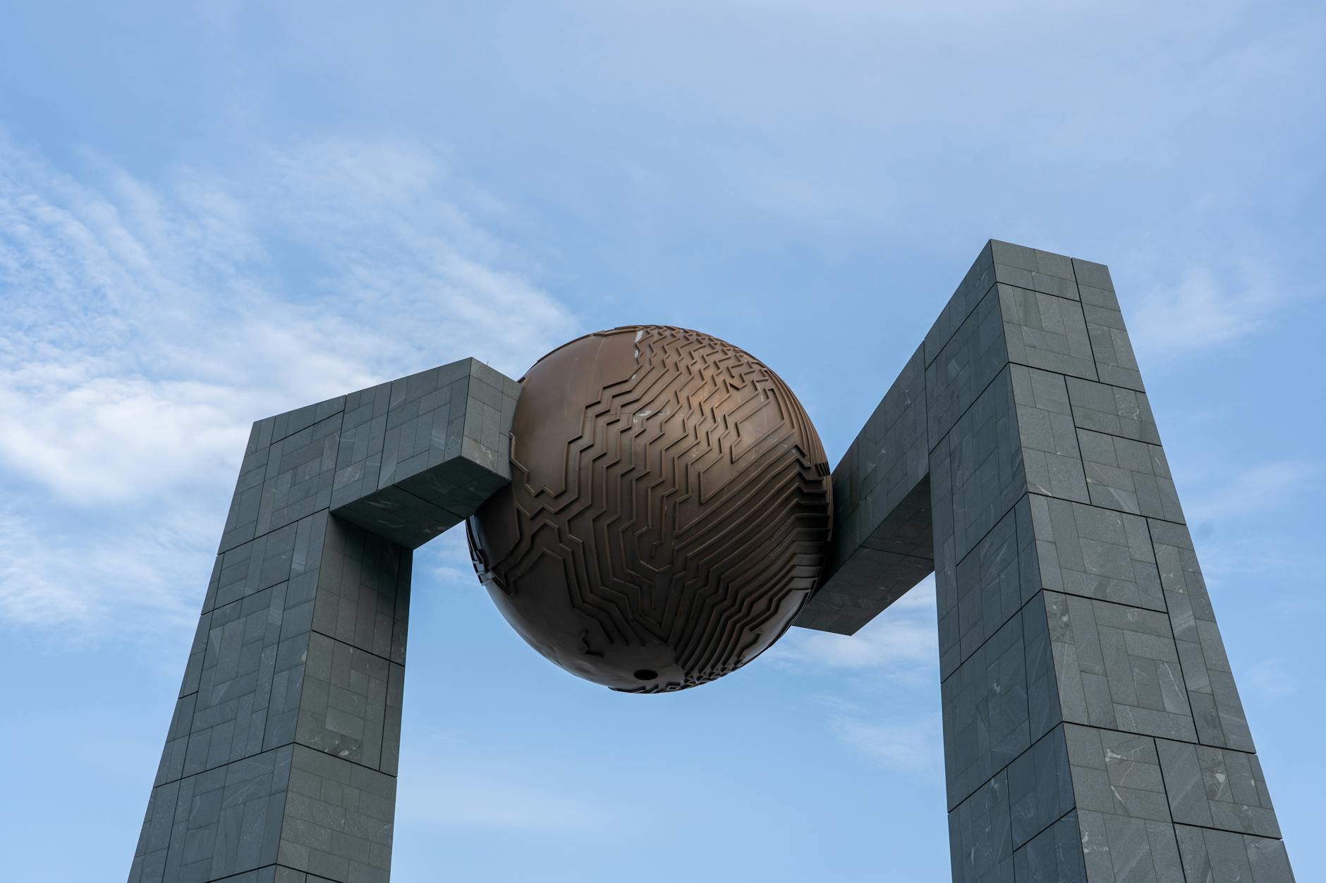 modern architectural sculpture against blue sky